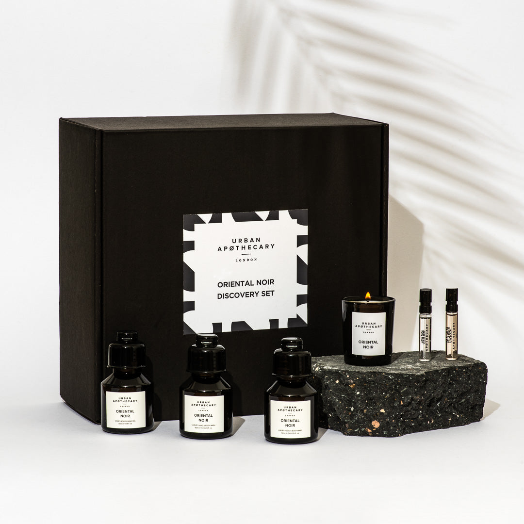 Set of perfume bottles and a candle with 'Urban Apothecary' branding on a white background.