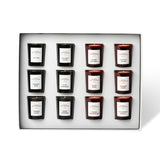 Set of twelve candles in a decorative box with labels on a white background